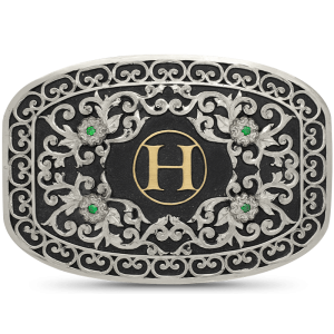 A custom belt buckle for women featuring a bronze ranch brand or personalized initial, with silver scrolls and frets frame 